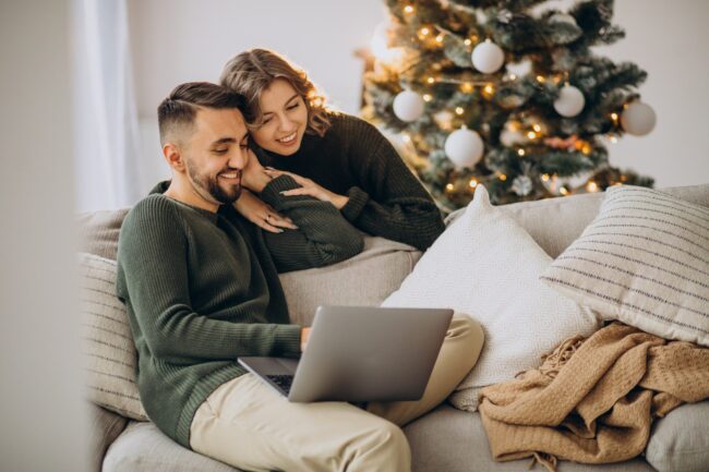 couple-on-video-call-with-laptop-computer-on-christmas-day (1)-min