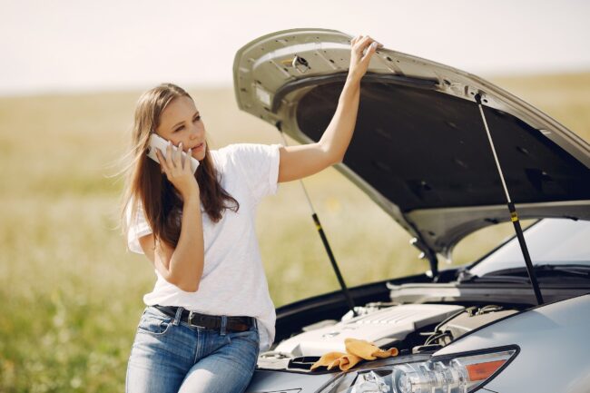 woman-near-broken-car-call-for-help-min